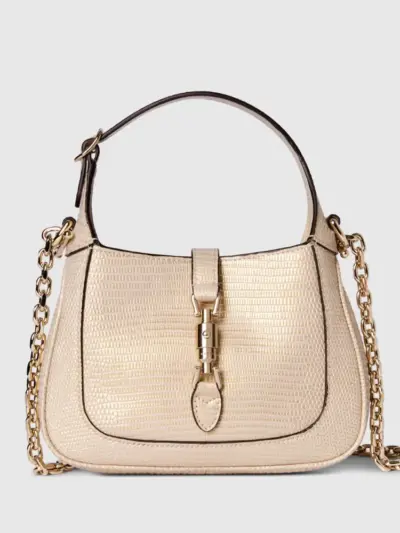 Gucci Jackie 1961 mini bag in pale metallic lizard textured leather, classic piston closure, top handle and removable gold metal chain crossbody strap